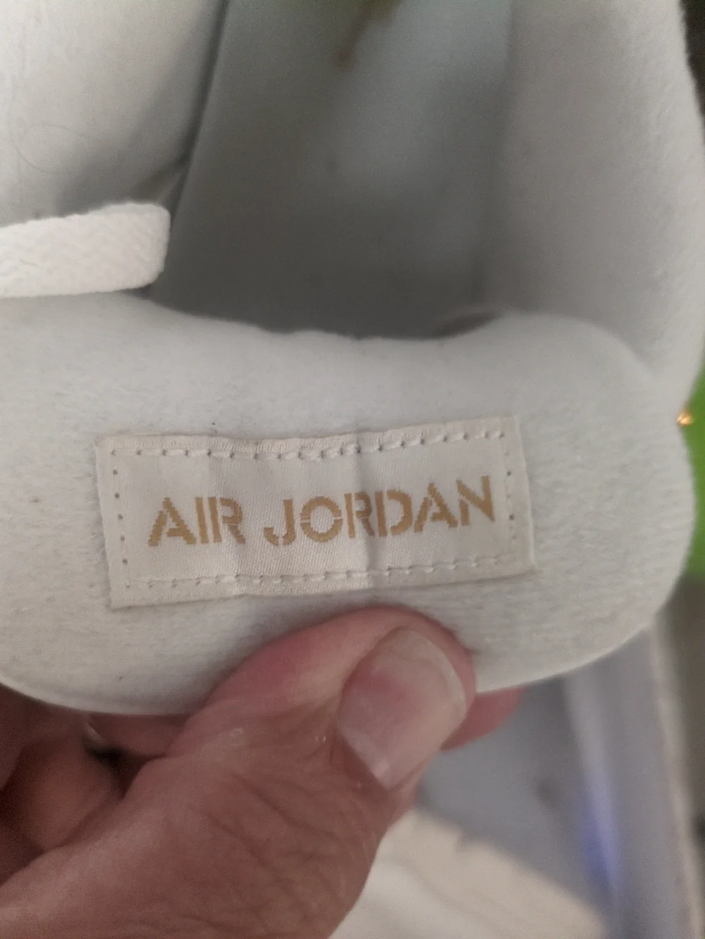 Air Jordan Women's All-White Sneakers with Gold Accents